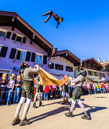 Mittenwald, Germany - February 28: Machkera is a traditional disguise with large wooden larvae, here shown at a parade on Feb 28, 2019 in Mittenwald, Germanyのeditorial素材
