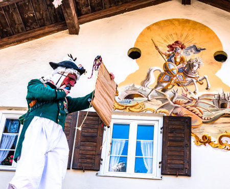 Mittenwald, Germany - February 28: Machkera is a traditional disguise with large wooden larvae, here shown at a parade on Feb 28, 2019 in Mittenwald, Germanyのeditorial素材