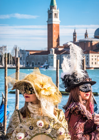 Venice, Italy - February 23: Participants of the Venice Carnival pose to the audience during the famous Carnival on February 23, 2019 in Venice, italyのeditorial素材