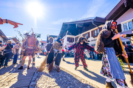 Mittenwald, Germany - February 28: Machkera is a traditional disguise with large wooden larvae, here shown at a parade on Feb 28, 2019 in Mittenwald, Germanyのeditorial素材