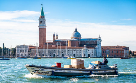 Venice, Italy - March 13: typical traffic with boats on the waterways and canals in venice, italy on March 13, 2019のeditorial素材