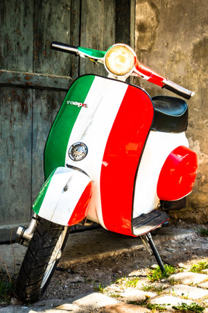 Parma, Italy - April 27: typical old Vespa small motorbike at the old town on April 27, 2018 in Parma, Italyのeditorial素材