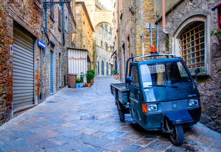 Volterra, Italy - July 9: typical old Piaggio APE transpoerter car at the old town on July 9, 2014 in Volterra, Italyのeditorial素材