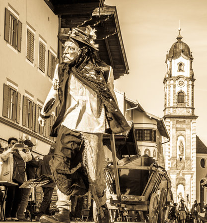 Mittenwald, Germany - February 28: Machkera is a traditional disguise with large wooden larvae, here shown at a parade on Feb 28, 2019 in Mittenwald, Germanyのeditorial素材