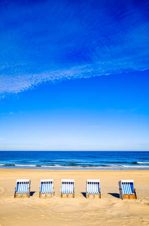 typical hooded beach chairs at a beach in north germanyの写真素材