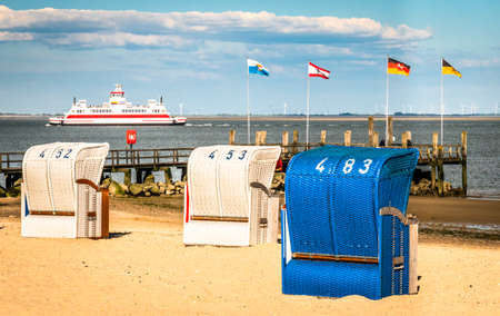 typical hooded beach chairs at a beach in north germanyの写真素材
