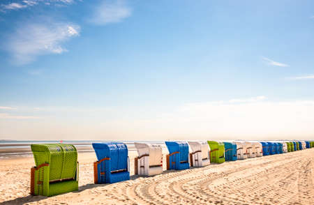 typical hooded beach chairs at a beach in north germanyの写真素材