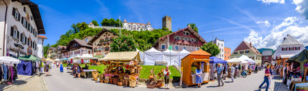 Neubeuern - Germany, June 1: sales booths at the historic clothes and craft market in the old town of Neubeuern on June 1, 2019のeditorial素材
