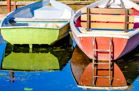 old wooden rowboat at a lakeの写真素材