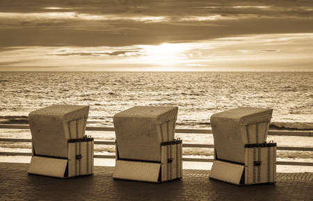 typical hooded beach chairs at a beach in north germanyの写真素材