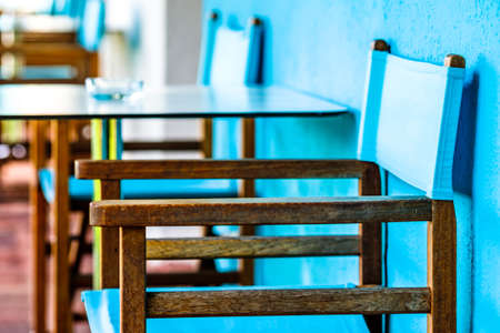 table and chairs at a sidewalk cafeの写真素材