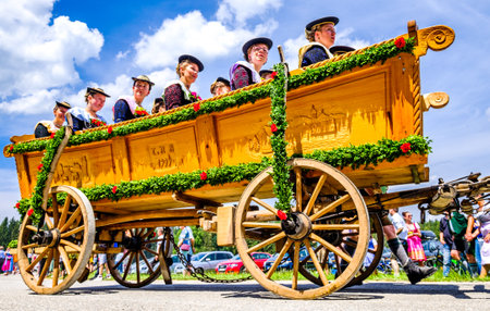 Dietramszell, Germany - July 20: people with traditional clothes at the annual horse-carriage procession with blessing, named leonhardifahrt on July 20, 2019 in Dietramszell, germanyのeditorial素材