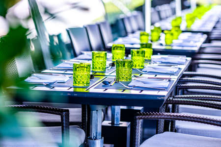 tables and chairs at a gourmet restaurantの写真素材