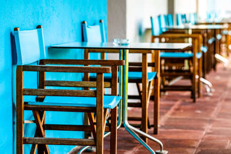 table and chairs at a sidewalk cafe