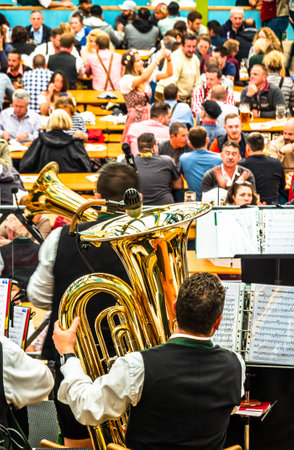 Munich, Germany - October 1: typcial brass musician at the oktoberfest in munich on October 1, 2018のeditorial素材