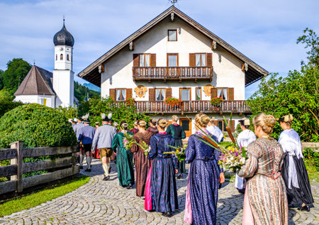 Kochel am See, Germany - August 15: participants in bavarian costumes during a typical procession to assumption day in Kochel am See on august 15, 2019のeditorial素材
