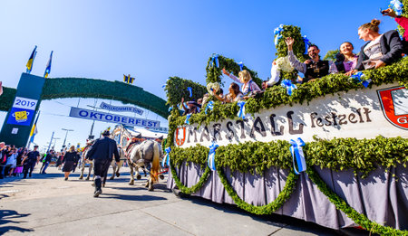 Munich, Germany - September 21: Participants, carts, marching bands of the annual opening parade called "einzug der wirte" of the oktoberfest on september 21, 2019 in the old town of munichのeditorial素材