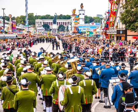 Munich, Germany - September 22: Participants, marching bands and carts at the annual opening parade of the oktoberfest on september 22, 2019 in the old town of munichのeditorial素材