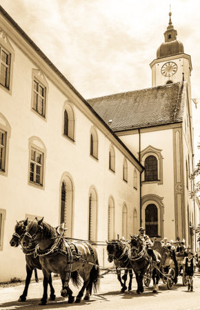 Dietramszell, Germany - July 20: people with traditional clothes at the annual horse-carriage procession with blessing, named leonhardifahrt on July 20, 2019 in Dietramszell, germanyのeditorial素材