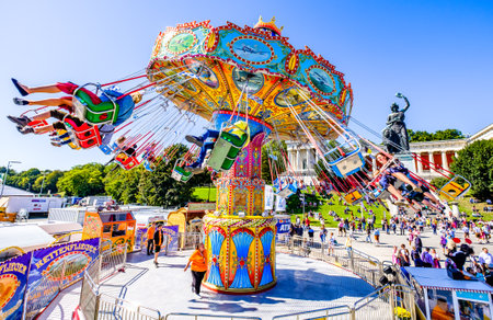 munich, Germany - September 21: the oktoberfest - carousels and people at the world greatest annual fair on september 21, 2019 in munichのeditorial素材