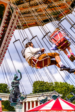 munich, Germany - September 24: the oktoberfest - chain carousel and people at the world greatest annual fair on september 24, 2019 in munichのeditorial素材
