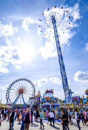 munich, Germany - September 24: the oktoberfest - carousels and people at the world greatest annual fair on september 24, 2019 in munichのeditorial素材