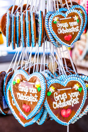 typical souvenir at the oktoberfest in munich - a gingerbread heart - lebkuchenherz - translation:...