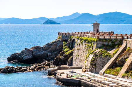 famous lighthouse at the harbor of piombino in italy