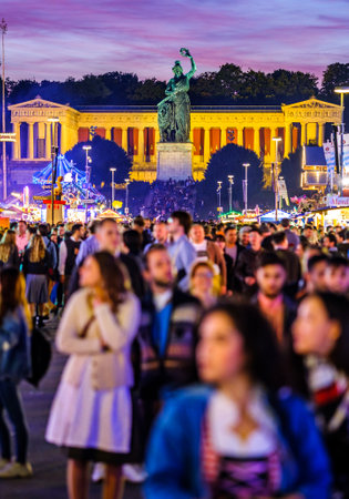 Munich, Germany - September 28: visitors, beertents and fairground rides on the oktoberfest in munich at September 28, 2019のeditorial素材