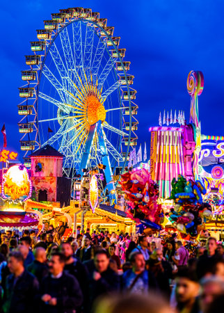 Munich, Germany - September 27: visitors, beertents and fairground rides on the oktoberfest in munich at September 27, 2019のeditorial素材