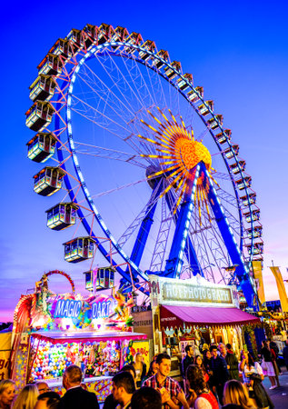 Munich, Germany - September 28: visitors, beertents and fairground rides on the oktoberfest in munich at September 28, 2019のeditorial素材