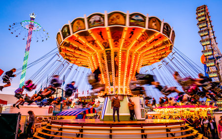 Munich, Germany - September 28: visitors, beertents and fairground rides on the oktoberfest in munich at September 28, 2019のeditorial素材
