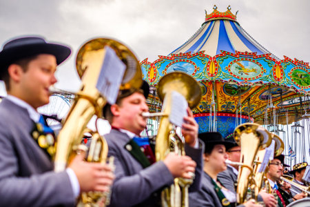 Munich, Germany - October 2019: The traditional marksmen parade with brass bands on the last day of the Oktoberfest. 60 shooters shoot a salute at the foot of the Bavaria statue on October 6, 2019 in Munichのeditorial素材