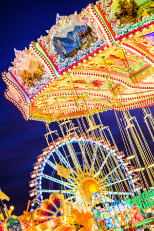 Munich, Germany - September 28: visitors, beertents and fairground rides on the oktoberfest in munich at September 28, 2019のeditorial素材