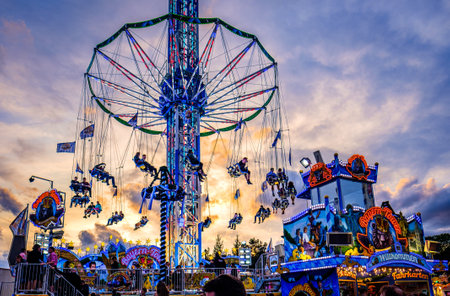 Munich, Germany - September 27: visitors, beertents and fairground rides on the oktoberfest in munich at September 27, 2019のeditorial素材