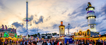 Munich, Germany - September 27: visitors, beertents and fairground rides on the oktoberfest in munich at September 27, 2019のeditorial素材