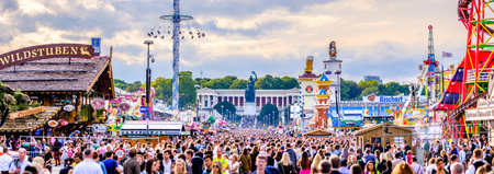 Munich, Germany - September 27: visitors, beertents and fairground rides on the oktoberfest in munich at September 27, 2019のeditorial素材