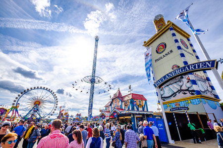 Munich, Germany - September 27: visitors, beertents and fairground rides on the oktoberfest in munich at September 27, 2019のeditorial素材