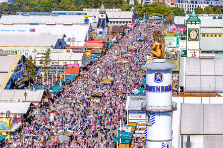 Munich, Germany - September 29: visitors, beertents and fairground rides on the oktoberfest in munich at September 29, 2019のeditorial素材