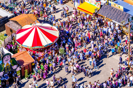 Munich, Germany - September 29: visitors, beertents and fairground rides on the oktoberfest in munich at September 29, 2019のeditorial素材