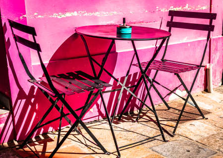 typical sidewalk restaurant in italyの写真素材