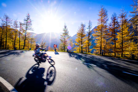 motorbike at the grossglockner mountain - blurred motionの写真素材