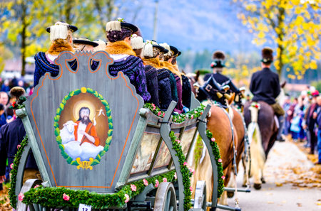 Benediktbeuern, Germany - November 3: people with traditional clothes at the annual horse-carriage procession with blessing, named leonhardifahrt on November 3, 2019 in Benediktbeuern, germanyのeditorial素材