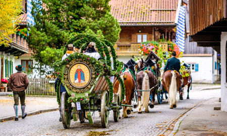 Benediktbeuern, Germany - November 3: people with traditional clothes at the annual horse-carriage procession with blessing, named leonhardifahrt on November 3, 2019 in Benediktbeuern, germanyのeditorial素材