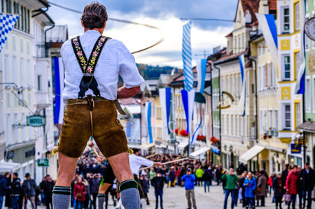 Bad Toelz, Germany - November 6: coachman with traditional clothes and popping whip at the annual leonhardifahrt procession on November 6, 2019 in bad toelz, germanyのeditorial素材