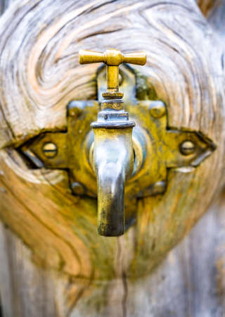 old faucet at a machineの写真素材