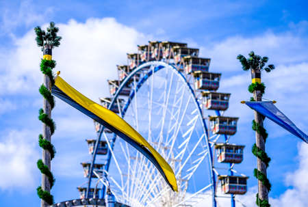 famous ferris wheel on the oktoberfest in munichの写真素材