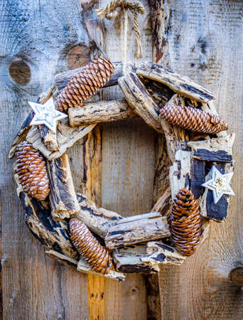 old christmas wreath at a doorの写真素材