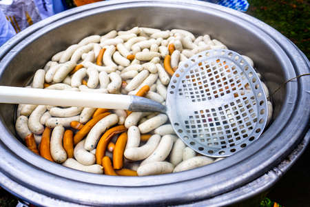 bavarian white sausages in a potの写真素材