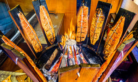 roasted salmon fish at a barbequeの写真素材